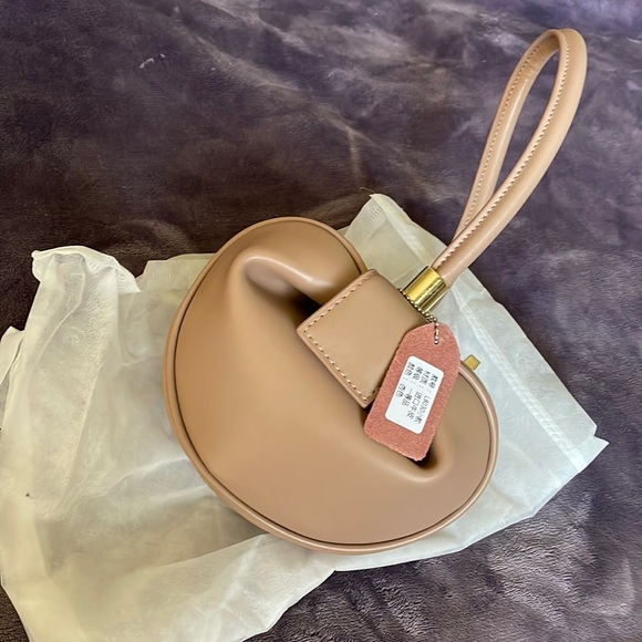 Beige small dumpling hobo bag I purchased brand new and never used. - Picture 11 of 11